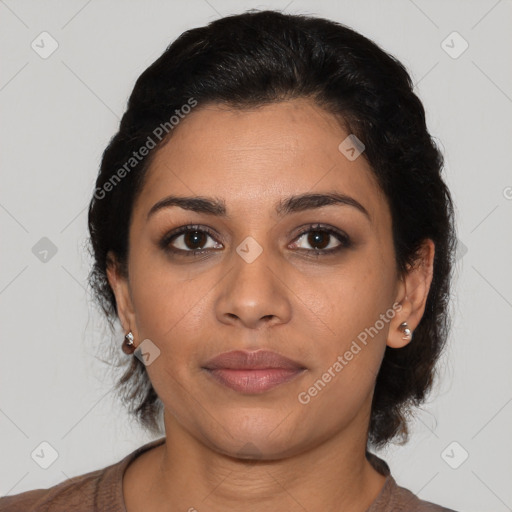 Joyful latino young-adult female with medium  brown hair and brown eyes