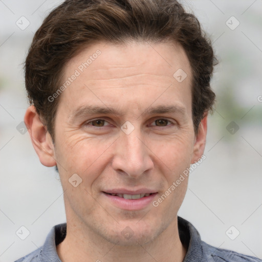 Joyful white adult male with short  brown hair and grey eyes