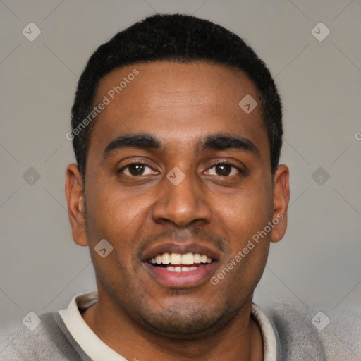 Joyful black young-adult male with short  black hair and brown eyes