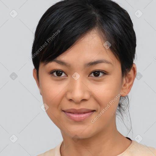 Joyful asian young-adult female with medium  black hair and brown eyes