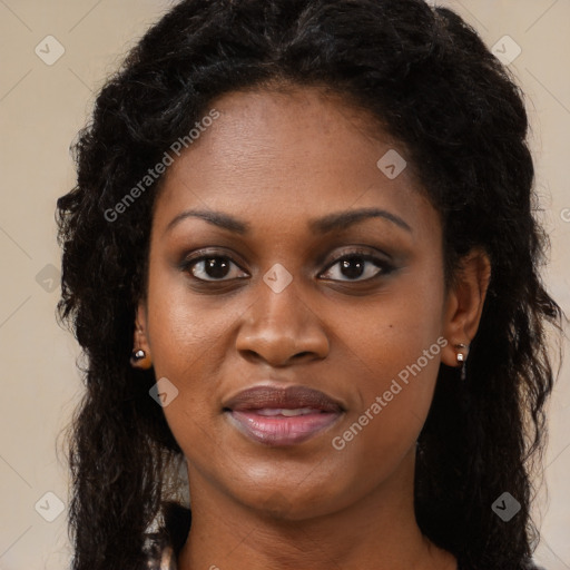 Joyful black young-adult female with long  black hair and brown eyes