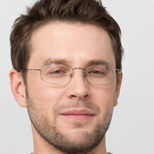 Joyful white adult male with short  brown hair and grey eyes