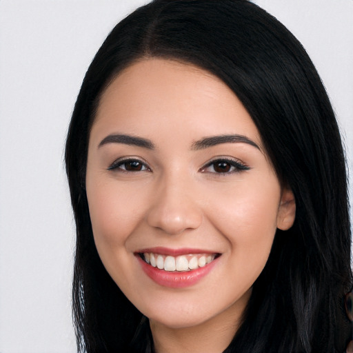 Joyful white young-adult female with long  black hair and brown eyes