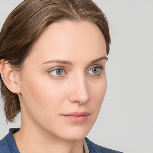 Neutral white young-adult female with medium  brown hair and blue eyes