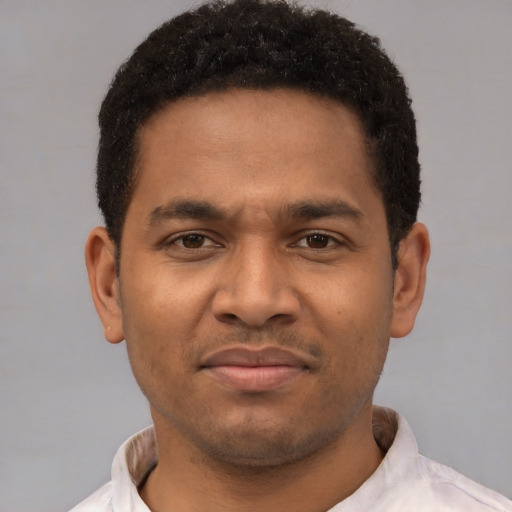 Neutral latino young-adult male with short  brown hair and brown eyes