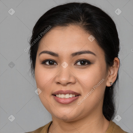 Joyful latino young-adult female with medium  brown hair and brown eyes