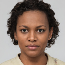 Neutral black young-adult female with short  brown hair and brown eyes