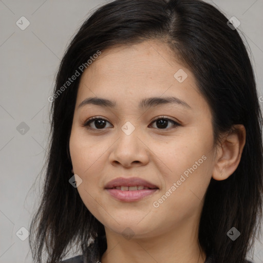 Joyful asian young-adult female with long  brown hair and brown eyes