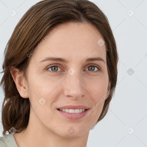 Joyful white young-adult female with medium  brown hair and green eyes