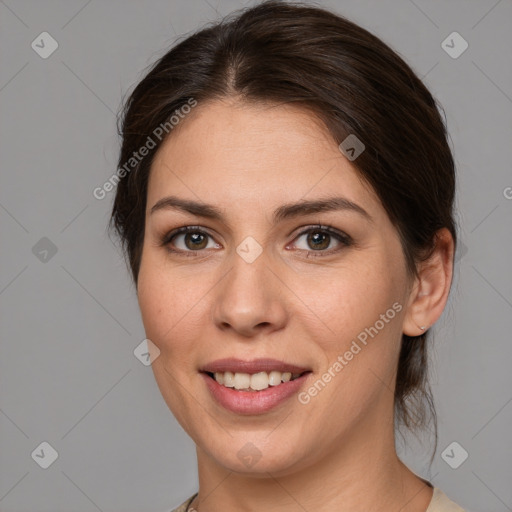 Joyful white young-adult female with medium  brown hair and brown eyes