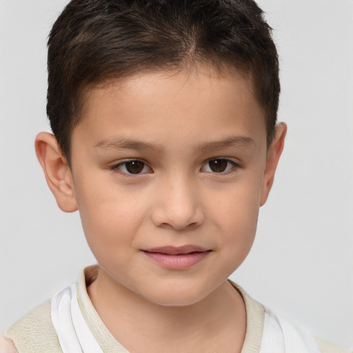 Joyful white child male with short  brown hair and brown eyes