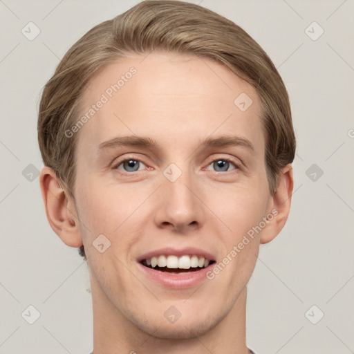 Joyful white young-adult male with short  brown hair and grey eyes