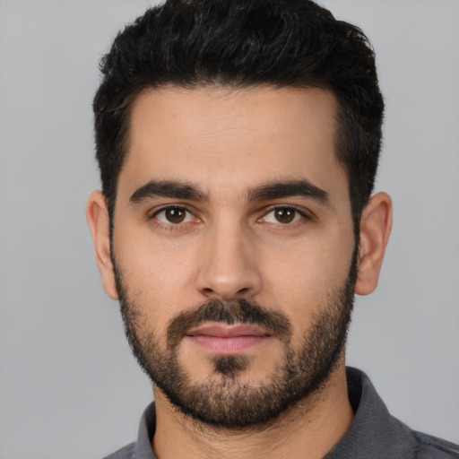 Neutral white young-adult male with short  black hair and brown eyes