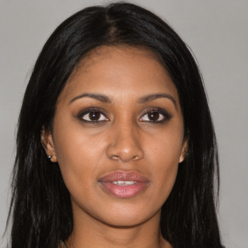Joyful asian young-adult female with long  black hair and brown eyes