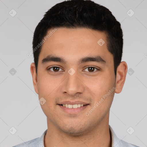 Joyful white young-adult male with short  black hair and brown eyes