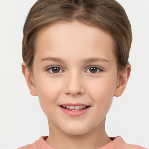 Joyful white child female with short  brown hair and brown eyes