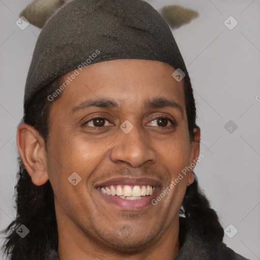 Joyful black young-adult male with short  brown hair and brown eyes