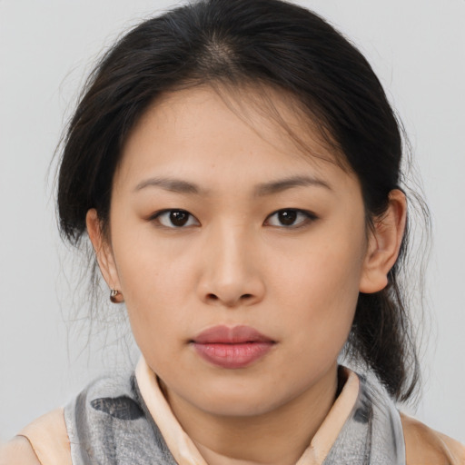 Neutral asian young-adult female with medium  brown hair and brown eyes