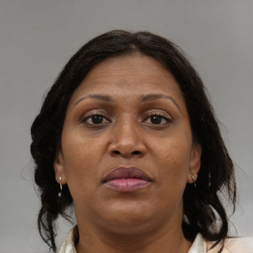 Neutral black adult female with medium  brown hair and brown eyes