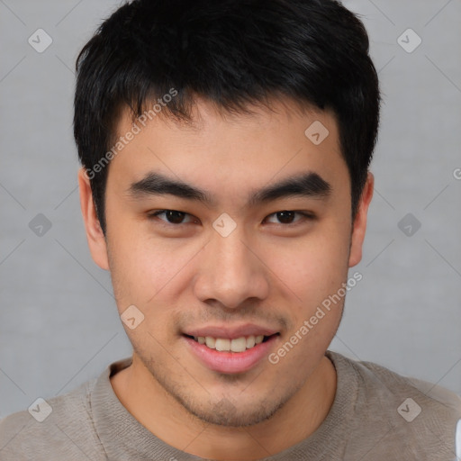 Joyful asian young-adult male with short  brown hair and brown eyes