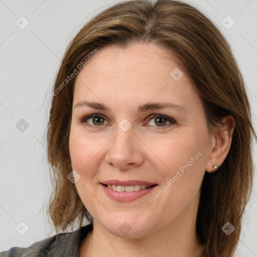 Joyful white adult female with medium  brown hair and brown eyes