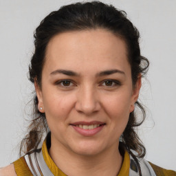 Joyful white young-adult female with medium  brown hair and brown eyes