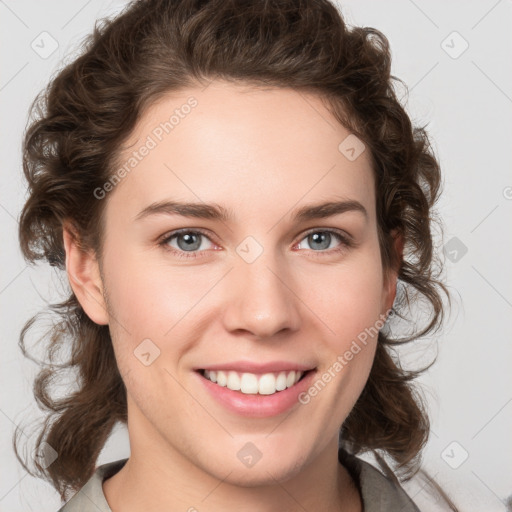 Joyful white young-adult female with medium  brown hair and green eyes