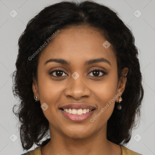 Joyful black young-adult female with long  brown hair and brown eyes