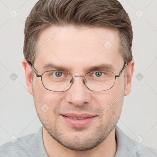 Joyful white adult male with short  brown hair and grey eyes