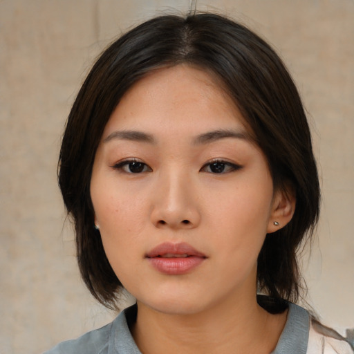 Neutral asian young-adult female with medium  black hair and brown eyes