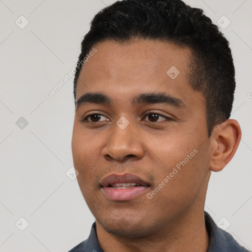 Joyful black young-adult male with short  black hair and brown eyes