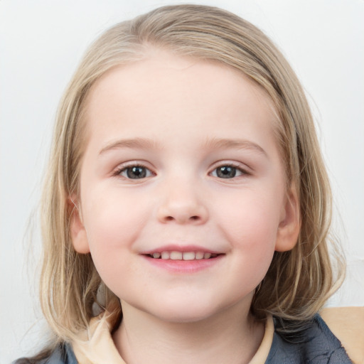 Joyful white child female with medium  brown hair and blue eyes