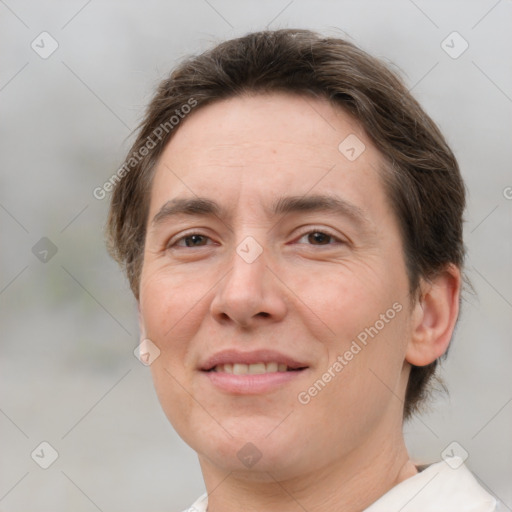 Joyful white adult female with short  brown hair and brown eyes