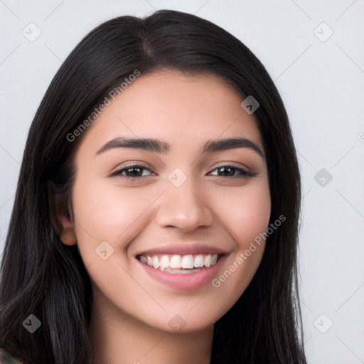 Joyful white young-adult female with long  black hair and brown eyes