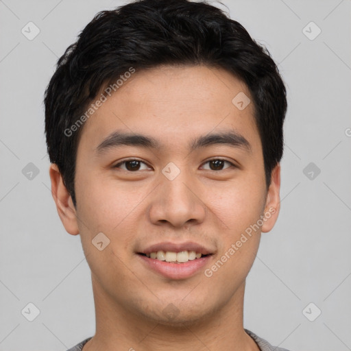 Joyful asian young-adult male with short  brown hair and brown eyes