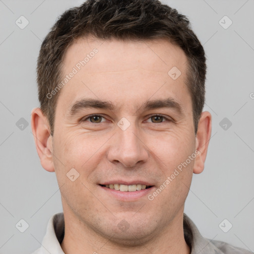 Joyful white adult male with short  brown hair and brown eyes