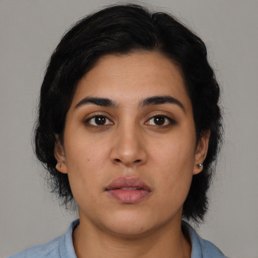 Neutral latino young-adult female with medium  black hair and brown eyes