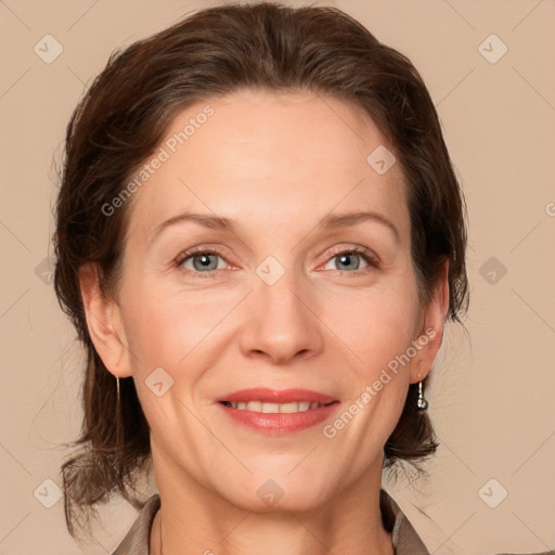 Joyful white adult female with medium  brown hair and grey eyes