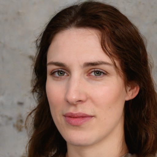 Joyful white young-adult female with medium  brown hair and green eyes