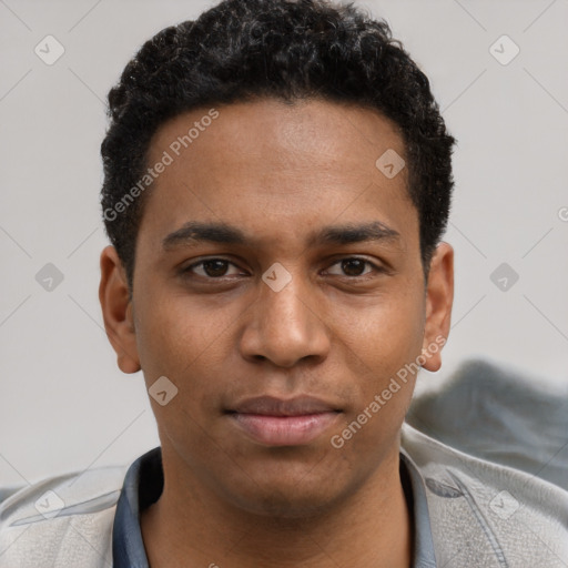 Joyful black young-adult male with short  brown hair and brown eyes