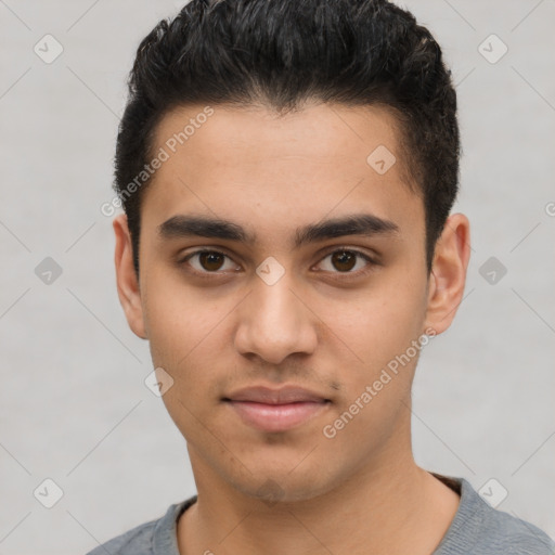 Joyful latino young-adult male with short  brown hair and brown eyes