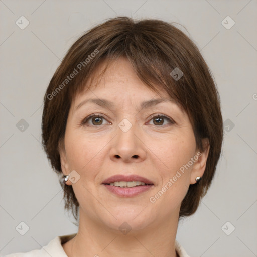 Joyful white adult female with medium  brown hair and brown eyes