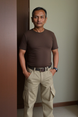 Nepalese 45 years male with  brown hair