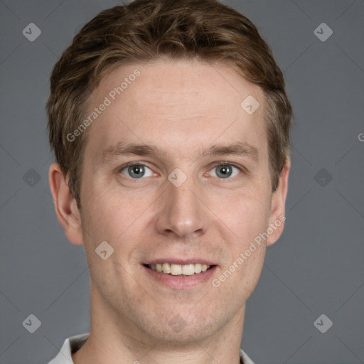 Joyful white adult male with short  brown hair and grey eyes