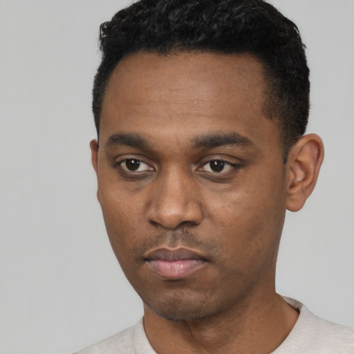 Neutral black young-adult male with short  black hair and brown eyes