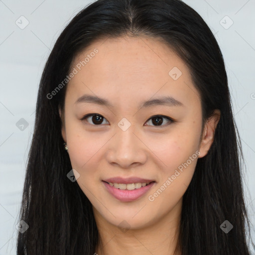 Joyful asian young-adult female with long  brown hair and brown eyes