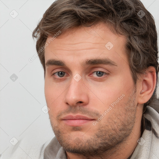 Neutral white young-adult male with short  brown hair and grey eyes