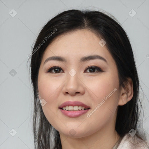 Joyful asian young-adult female with medium  black hair and brown eyes