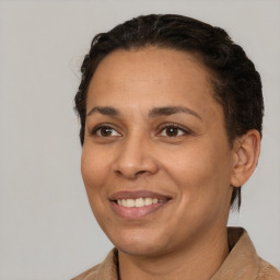 Joyful white adult female with short  brown hair and brown eyes