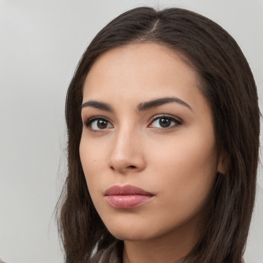 Neutral white young-adult female with long  brown hair and brown eyes